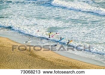 Stock Photo - 'white surf and 
beach where surfer 
school sets out 
for surfing in. 
fotosearch - search 
stock photos, 
pictures, images, 
and photo clipart
