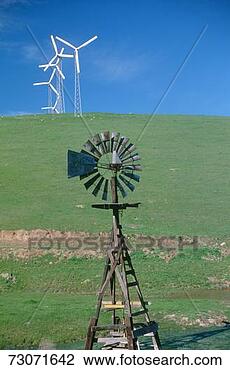 Stock Photo - 'wooden windmill 
in foreground 
with wind turbines, 
south dakota'. 
fotosearch - search 
stock photos, 
pictures, images, 
and photo clipart