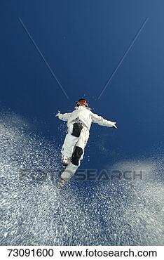 Stock Photography - young man jumping 
in ski-wear, view 
from below. fotosearch 
- search stock 
photos, pictures, 
images, and photo 
clipart