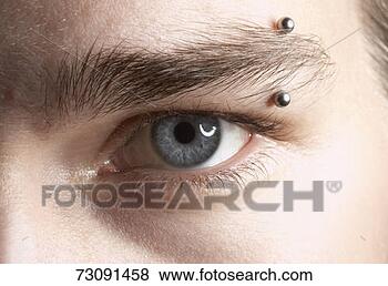 Stock Photo - young man with 
piercing in eyebrow, 
close-up. fotosearch 
- search stock 
photos, pictures, 
images, and photo 
clipart