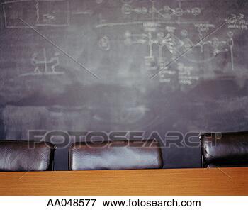 Picture - chairs and table 
in front of blackboard. 
fotosearch - search 
stock photos, 
pictures, images, 
and photo clipart