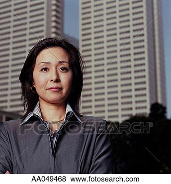 Stock Photo - japanese businesswoman 
in front of skyscrapers. 
fotosearch - search 
stock photos, 
pictures, images, 
and photo clipart