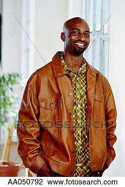 Stock Photo - portrait of man 
in leather jacket 
with hands in 
pocket. fotosearch 
- search stock 
photos, pictures, 
images, and photo 
clipart