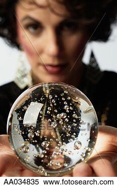 Stock Image - woman holding 
a crystal ball. 
fotosearch - search 
stock photos, 
pictures, images, 
and photo clipart