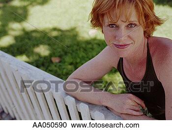Stock Photography - woman leaning 
on white picket 
fence. fotosearch 
- search stock 
photos, pictures, 
images, and photo 
clipart
