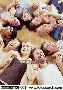 Stock Photography - group of dancers 
lying shoulder-to-shoulder 
in circle, elevated 
view. fotosearch 
- search stock 
photos, pictures, 
images, and photo 
clipart