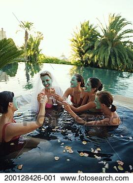 Stock Photography - five women wearing 
face masks in 
hot tub, one wearing 
bridal veil. fotosearch 
- search stock 
photos, pictures, 
images, and photo 
clipart