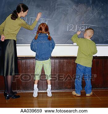 Stock Photograph - elementary school 
children writing 
on chalk board. 
fotosearch - search 
stock photos, 
pictures, images, 
and photo clipart