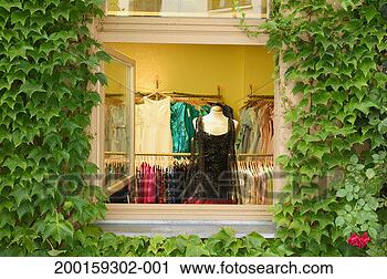 Stock Photography - clothes shop, 
view through window 
surrounded by 
ivy (hedera sp). 
fotosearch - search 
stock photos, 
pictures, images, 
and photo clipart