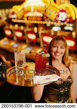 Stock Photography - waitress carrying 
drinks on tray, 
portrait (focus 
on drinks). fotosearch 
- search stock 
photos, pictures, 
images, and photo 
clipart