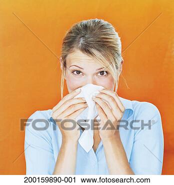 Stock Photography - woman blowing 
nose on tissue, 
portrait, close-up. 
fotosearch - search 
stock photos, 
pictures, images, 
and photo clipart