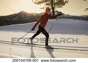 Stock Photography - young woman cross-country 
skiing, profile. 
fotosearch - search 
stock photos, 
pictures, images, 
and photo clipart