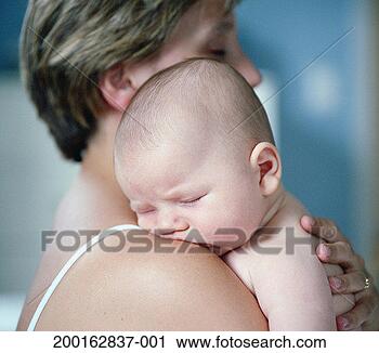 Stock Photography - baby boy (0-3 
months) sleeping 
on mother's shoulder 
(focus on baby). 
fotosearch - search 
stock photos, 
pictures, images, 
and photo clipart