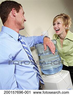 Stock Photography - businessman and 
businesswoman 
talking beside 
water cooler. 
fotosearch - search 
stock photos, 
pictures, images, 
and photo clipart