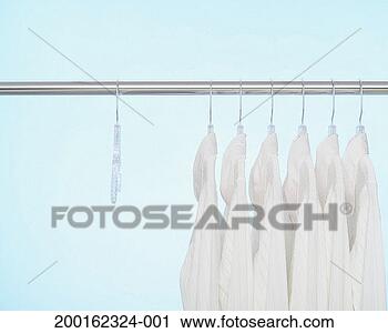 Stock Photography - button down shirts 
on hangers on 
clothes rack. 
fotosearch - search 
stock photos, 
pictures, images, 
and photo clipart