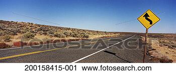 Stock Photography - empty highway 
with directional 
sign indicating 
curve ahead. fotosearch 
- search stock 
photos, pictures, 
images, and photo 
clipart