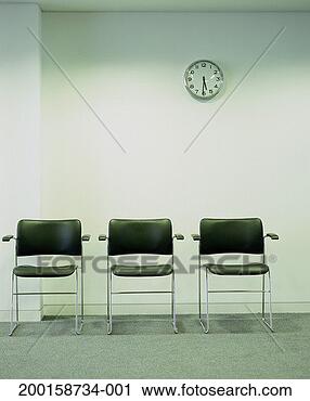 Stock Photography - row of three empty 
office chairs, 
under wall clock. 
fotosearch - search 
stock photos, 
pictures, images, 
and photo clipart