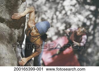 Stock Photography - two female rock 
climbers, elevated 
view (focus on 
woman on rock 
face). fotosearch 
- search stock 
photos, pictures, 
images, and photo 
clipart