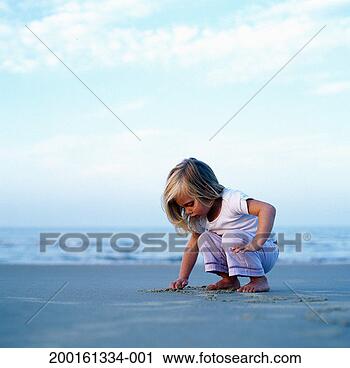 Stock Photography - young girl (2-4) 
playing in sand 
on beach, ground 
view. fotosearch 
- search stock 
photos, pictures, 
images, and photo 
clipart