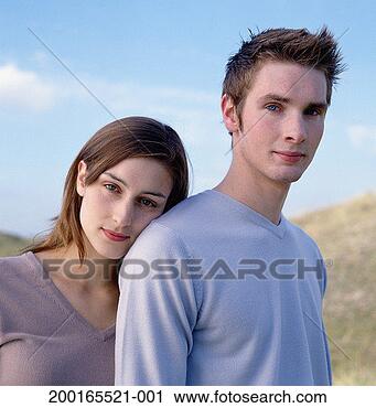 Stock Photography - young woman resting 
head on young 
man's shoulder, 
portrait. fotosearch 
- search stock 
photos, pictures, 
images, and photo 
clipart