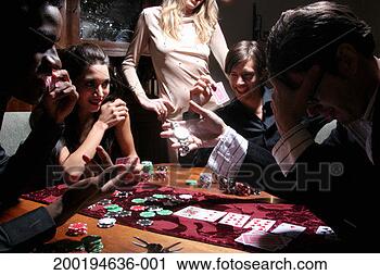 Stock Photography - five young adults 
playing poker, 
one man betting 
wristwatch. fotosearch 
- search stock 
photos, pictures, 
images, and photo 
clipart