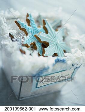 Stock Photography - frosted and decorated 
snowflake-shaped 
cookies in box. 
fotosearch - search 
stock photos, 
pictures, images, 
and photo clipart
