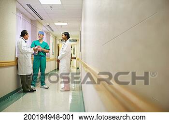 Stock Photography - hospital medical 
staff members 
conferring in 
corridor. fotosearch 
- search stock 
photos, pictures, 
images, and photo 
clipart