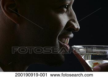Stock Photography - man smiling, holding 
martini, profile. 
fotosearch - search 
stock photos, 
pictures, images, 
and photo clipart