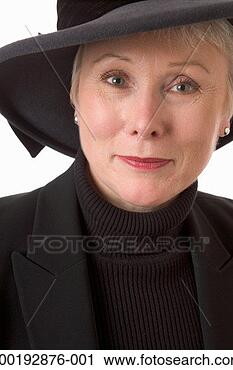 Stock Photography - mature woman wearing 
hat, smiling, 
portrait, close-up. 
fotosearch - search 
stock photos, 
pictures, images, 
and photo clipart