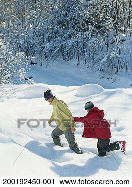 Stock Photography - mother and daughter 
(8-10) running 
through snow, 
elevated view. 
fotosearch - search 
stock photos, 
pictures, images, 
and photo clipart