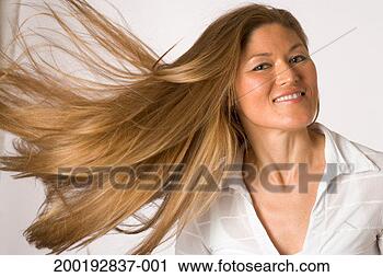 Stock Photography - woman flipping 
hair, smiling, 
portrait. fotosearch 
- search stock 
photos, pictures, 
images, and photo 
clipart