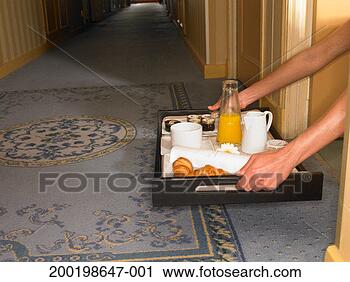 Stock Photography - woman picking 
up breakfast tray 
from floor by 
hotel room. fotosearch 
- search stock 
photos, pictures, 
images, and photo 
clipart