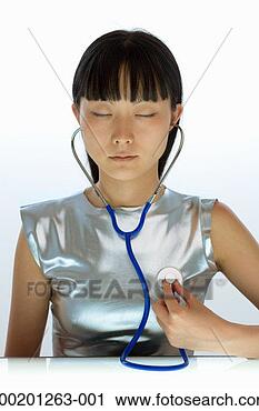 Stock Photography - young woman with 
stethoscope, eyes 
closed, close-up. 
fotosearch - search 
stock photos, 
pictures, images, 
and photo clipart