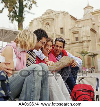 Stock Photo - four friends examining 
map. fotosearch 
- search stock 
photos, pictures, 
images, and photo 
clipart