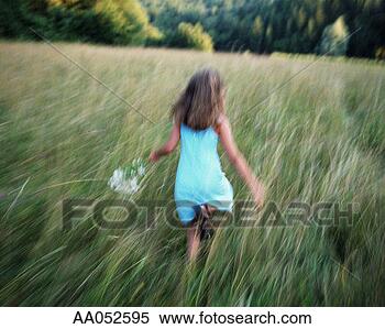 Stock Image - girl (8-10) running 
through field, 
summer, rear view 
(panning). fotosearch 
- search stock 
photos, pictures, 
images, and photo 
clipart