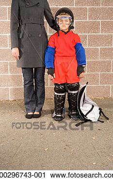 Stock Photography - boy (8-10) in 
protective gear, 
standing next 
to woman, portrait. 
fotosearch - search 
stock photos, 
pictures, images, 
and photo clipart