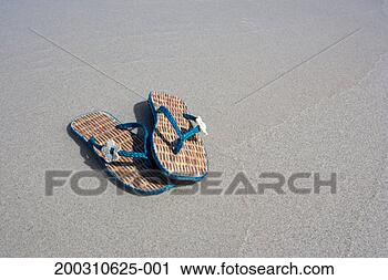 Stock Photography - flip flops on 
beach. fotosearch 
- search stock 
photos, pictures, 
images, and photo 
clipart