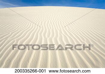 Stock Photography - flowing patterns 
and shapes created 
by wind on white 
gypsum sand dunes. 
fotosearch - search 
stock photos, 
pictures, images, 
and photo clipart