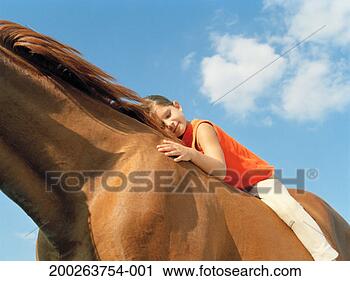 Stock Photography - girl (6-8) on 
horse resting 
head on horse's 
neck, eyes closed, 
smiling. fotosearch 
- search stock 
photos, pictures, 
images, and photo 
clipart