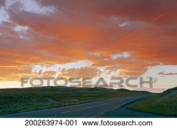 Stock Photography - highway near valley 
at sunset. fotosearch 
- search stock 
photos, pictures, 
images, and photo 
clipart