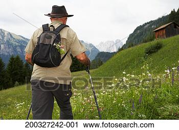 Stock Photography - italy, alto adige, 
dolomites, man 
hiking through 
fassa valley. 
fotosearch - search 
stock photos, 
pictures, images, 
and photo clipart