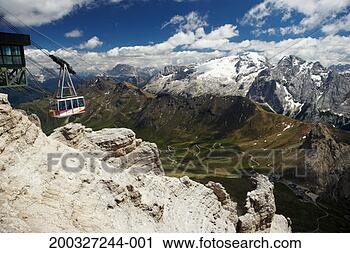 Stock Photography - italy, alto adige, 
dolomites, overhead 
cable cars on 
sass pordoi. fotosearch 
- search stock 
photos, pictures, 
images, and photo 
clipart