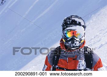 Stock Photography - male skier with 
snow packed onto 
mask after falling 
in snow, close-up. 
fotosearch - search 
stock photos, 
pictures, images, 
and photo clipart