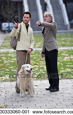 Stock Photography - mature man in 
street giving 
directions to 
mature man with 
dog. fotosearch 
- search stock 
photos, pictures, 
images, and photo 
clipart