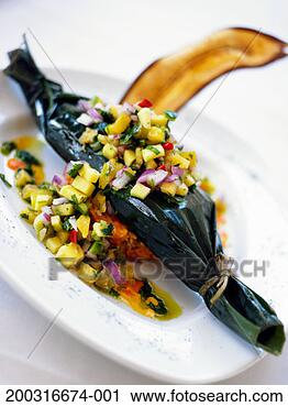 Stock Photography - pork wrapped in 
banana leaf with 
mango salsa, elevated 
view. fotosearch 
- search stock 
photos, pictures, 
images, and photo 
clipart