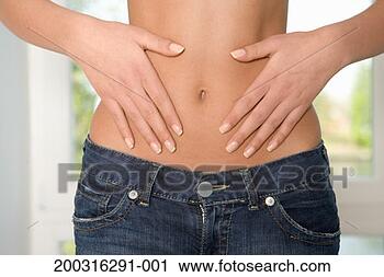 Stock Photography - teenage girl (16-18) 
with hands on 
waist, mid section, 
close up. fotosearch 
- search stock 
photos, pictures, 
images, and photo 
clipart