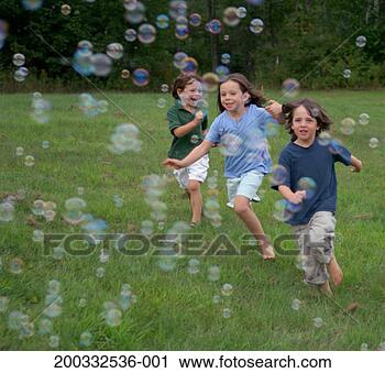 Stock Photography - three children 
(3-7) chasing 
bubbles, smiling. 
fotosearch - search 
stock photos, 
pictures, images, 
and photo clipart