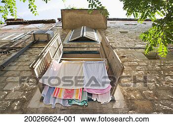Stock Photography - washing hanging 
out window from 
clothes airer, 
low angle view. 
fotosearch - search 
stock photos, 
pictures, images, 
and photo clipart
