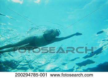 Stock Photography - woman swimming, 
view from below, 
underwater view. 
fotosearch - search 
stock photos, 
pictures, images, 
and photo clipart