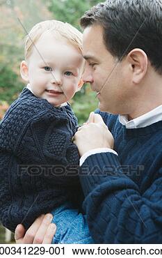 Stock Photography - father carrying 
son (2-4) outdoors. 
fotosearch - search 
stock photos, 
pictures, images, 
and photo clipart